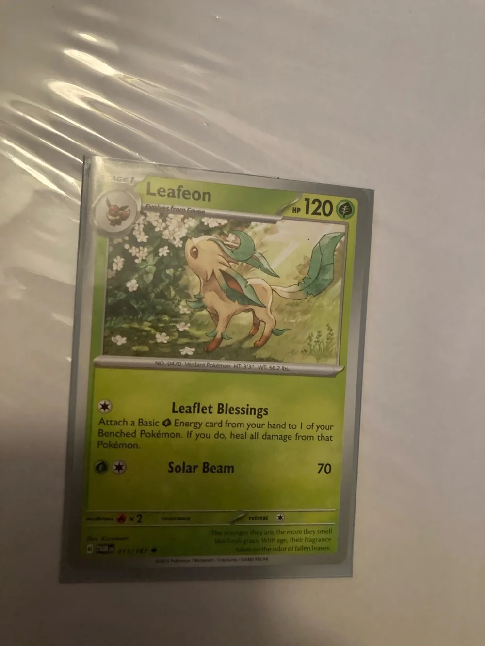 Pokemon Leafeon Green Trading Card and sleeve